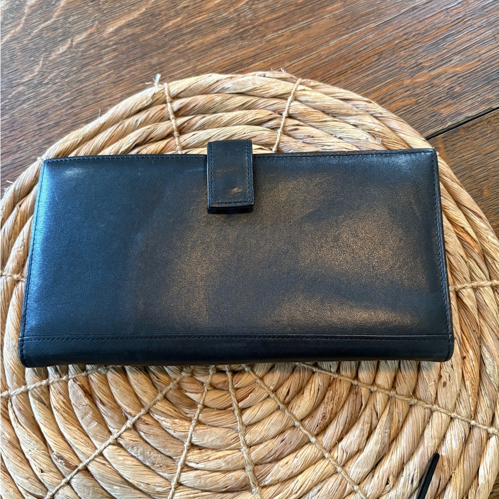 Tumi travel wallet passport card organizer.
